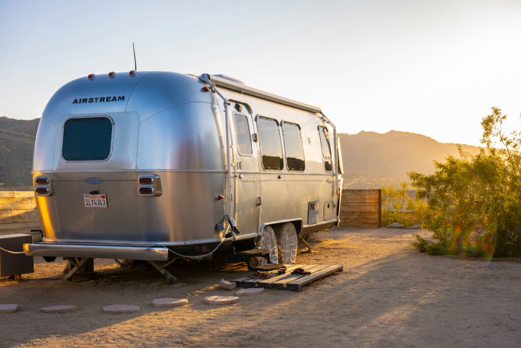 RV camper parked at a mountain campsite in Colorado