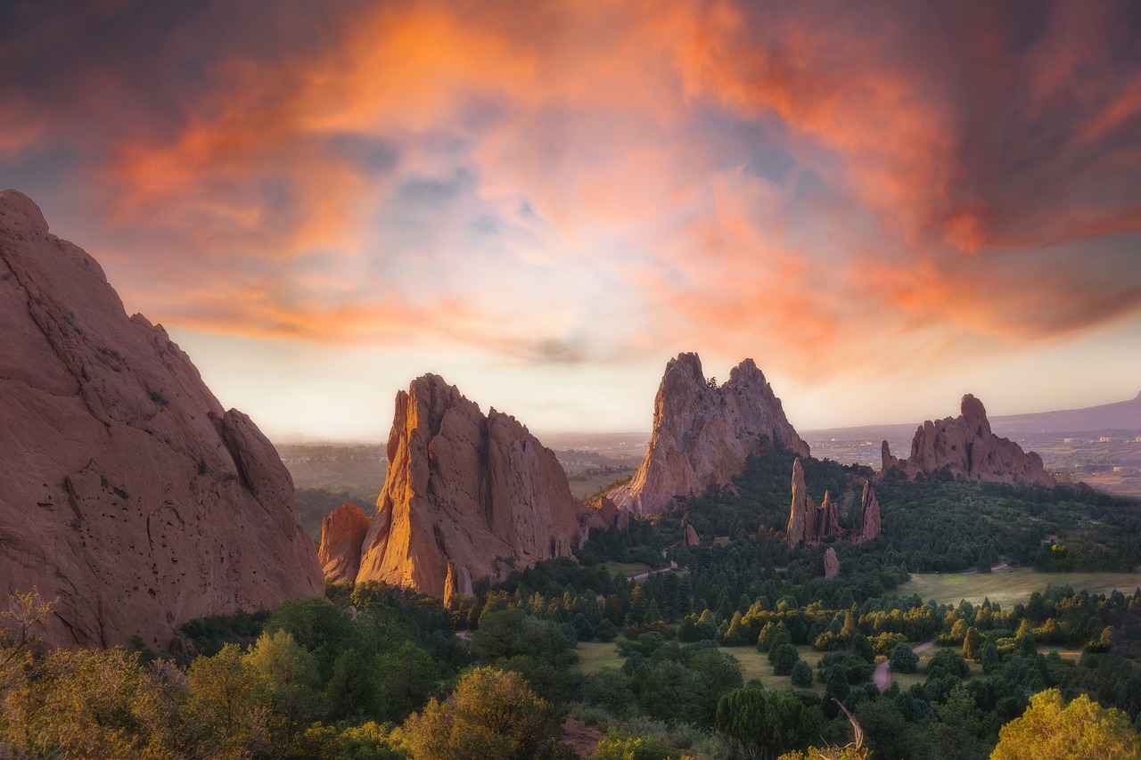 garden-of-the-gods-7316070_1280 - Colorado Frontiers Sunset over orange rock formations of Garden of the Gods, with green trees and a distant valley beneath the dramatic sky C5.a (informative)