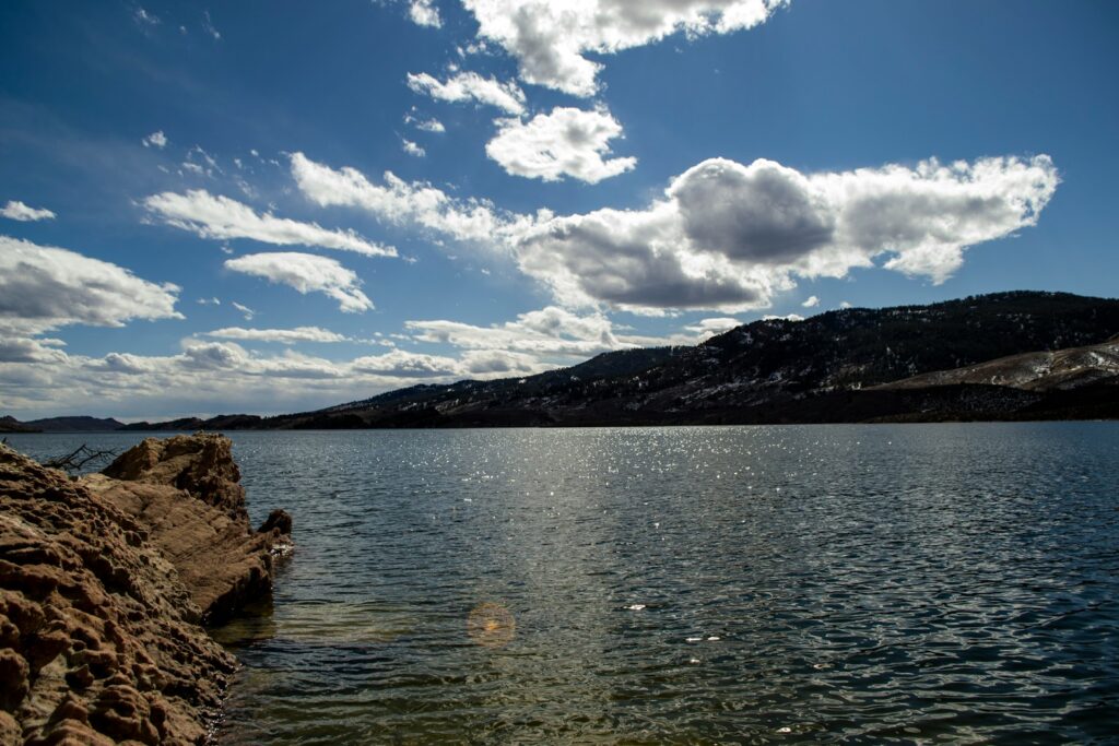 body of water near mountain under blue sky during daytime, horsetooth reservoir