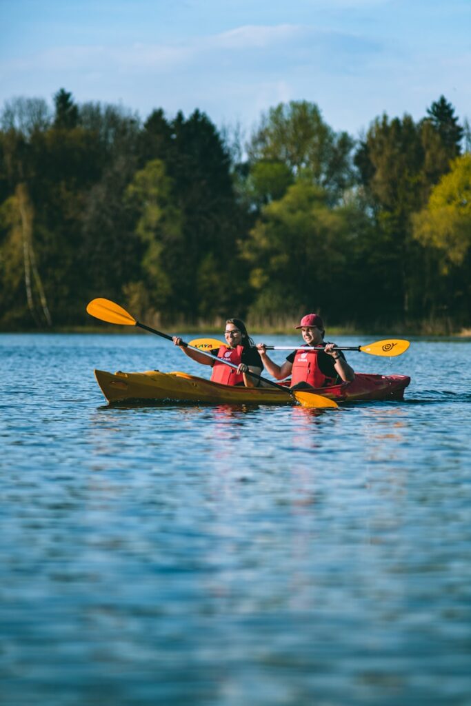 Photo by Serhii Danevych - Colorado Frontiers two people in a kayak paddling on a lake
